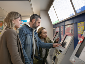 Tourists booking their train tickets, Japan