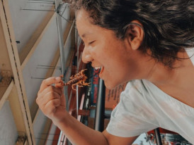 Woman eating scorpion