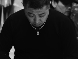 Chef slicing fish at market Photo by Noe Garde on pexels