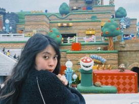 Guests snapping photos near theme park gates Photo by Trang Nè on pexels