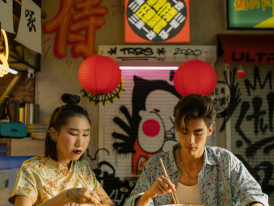 Satisfied visitors and locals sharing a meal together at street food stalls as the sun sets over Osaka. Photo by cottonbro studio: https://wwpexels