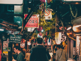 Traditional lanterns hanging in modern alley.