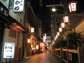 Traditional alley recreation with people walking around.