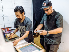 Designer sketching in Orange Street café.