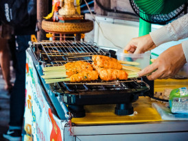 Vendor grilling takoyaki. Photo by Nam Phong Bùi Pexels
