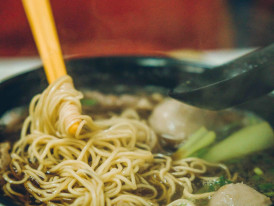 Assorted oden ingredients steaming in broth.