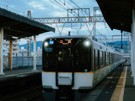 Clean, modern airport express train at platform in Osaka Station Photo by Peter Thomas on Unsplash