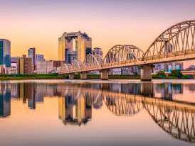 Sunset view of Osaka with mixture of old and new architecture, capturing the city's essence.