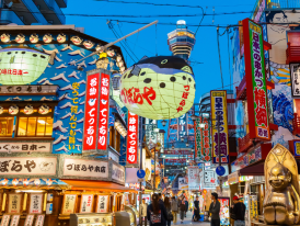 Retro items displayed in a shop window along Janjan Yokocho’s narrow shopping street.