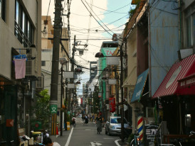 Namba district street showing mix of modern shops and traditional elements Photo by Bruna Santos on Unsplash
