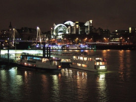 Festival boats illuminated at night on river. photo by Derek Harper on Creative Commons Attribution-Share Alike 2.0