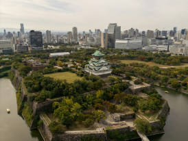 Osaka skyline from above with castle park visible photo by  Clayton Cardinalli  Unsplash