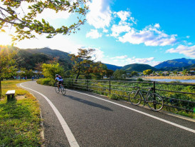 Local cyclist riding along Dotonbori River in the morning.