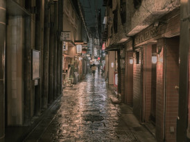 Narrow street with pastel-painted houses