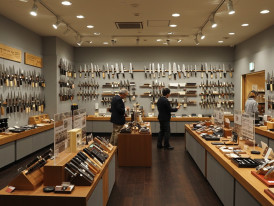 Interior of knife store with wall displays.