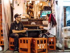 A guide sharing a personal story with guests in a relaxed, cozy setting.