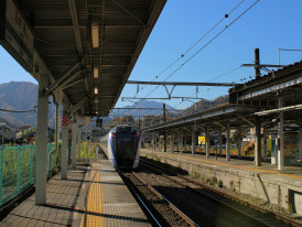A bullet train arriving at Kyoto Station with Mount Fuji visible in the distance Photo by Dhruv Patel on Unsplash