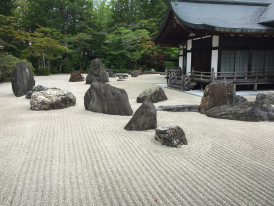 The famous rock garden at Ryoan-ji temple with 15 stones arranged in raked gravel Photo by Ray Wyman Jr on Unsplash