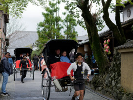 Traditional neighborhood street with local residents going about daily activities. Image by Kelvin Zyteng from Unsplash