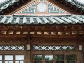 Silver Pavilion's weathered wood exterior with traditional garden elements in foreground Photo by Paul Bill on Unsplash