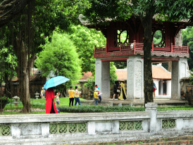 Local residents practicing tai chi in Imperial Park with traditional buildings in background Photo by Ama Journey on Unsplash
