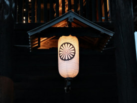 Traditional wooden storefront with lantern Photo by Alex T on Unsplash