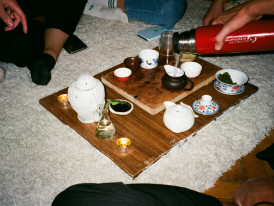 Host and guest sitting for tea, sharing stories Photo by Julia Tsukurova on Unsplash