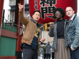Host guiding guests through Osaka.