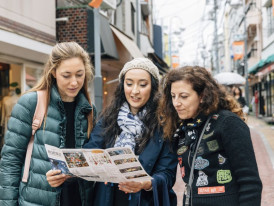 Tourists looking at map.