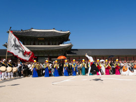 Grand entrance gates of Kyoto Imperial Palace with festival participants in colorful historical costumes gathering in the courtyard. Image by Shibin Joseph from Unsplash