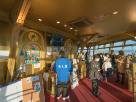 Modern exhibit space with lighting and displays inside Tsutenkaku Tower. Image by Tooykrub on Shutterstock.