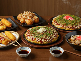 Various Osaka specialty dishes arranged on a table