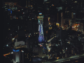 View from Tsutenkaku Tower observation deck showing Osaka spread below. Photo by Cheng on pexels