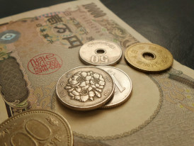 Japanese yen bills and coins on table with receipt Photo by Possessed Photography on Unsplash