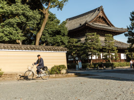 Quiet Kyoto alley with temples in frame
