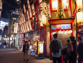 Small group walking down quiet alley with a local