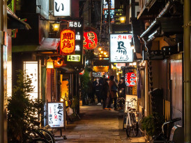 Quiet alley framed by hanging lanterns