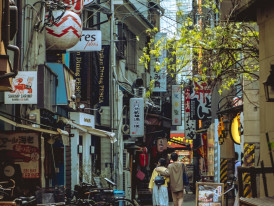 Confident traveler reading Japanese signs independently on a quiet street Photo by Ramon Linares on pexels