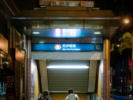 Smiling goodbye scene in front of a subway entrance with host and travelers. Photo by Jimmy Chan on pexels