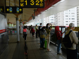 Traveler boarding Nankai line train with day bag Photo by MChe Lee on Unsplash