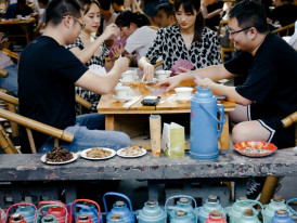  Locals sharing a meal at plastic tables Photo by billow926 on Unsplash