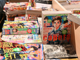 Browsing limited-edition manga.Photo by Teeny Tina on Unsplash