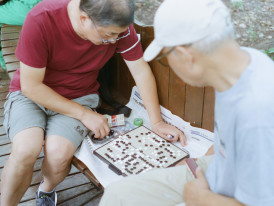 Local residents playing traditional games in the castle park. Photo by Derek Lee on Unsplash