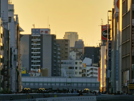 Guests walking with host near Dotombori riverbank at sunset Photo by Muhammad Luqman Haqiem Bin Nazri on Unsplash