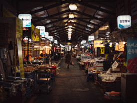 Colorful morning market scene with fresh ingredients and bustling vendors. Photo by rawkkim on Unsplash