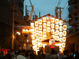 Traditional festival scene with locals in colorful clothing and guests participating Photo by David Emrich on Unsplash