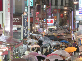 Covered shopping street during rainy weather with normal crowd levels Photo by Peter Conrad on Unsplash