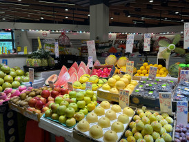 Colorful produce display at local market. Photo by demi kyu on Unsplash