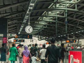 Busy Osaka Station platform with commuters and clear signage showing the loop line. Photo by Roktim Razee on pexels