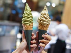 Premium matcha soft serve ice cream with rich green color and elegant presentation